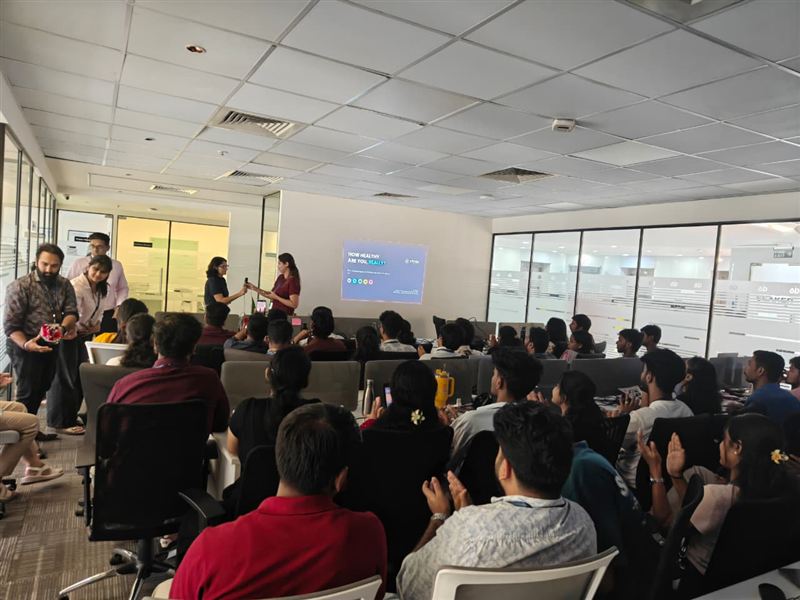 Employees listening to a health talk in their office